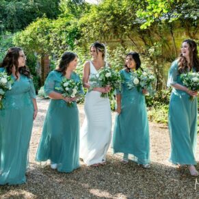 The bride takes a relaxed stroll with her bridesmaids during the photo-call on the day