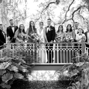 The bridge was the most idyllic backdrop for this atmospheric black and white shot of the bridal party