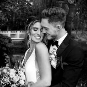 Classic romantic black and white portrait of the newlyweds captured in the woodlands during their reception