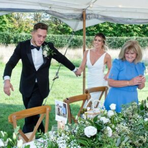 The newlyweds make their grand entrance into the marquee for their Old Windsor celebrations