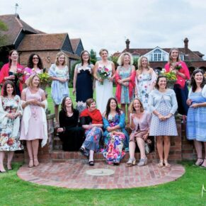 Micklefield Hall Wedding Photography - group pose of the bride with her girlfriends in the gardens