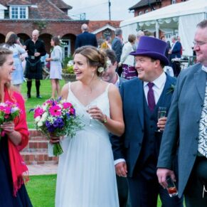 Micklefield Hall Wedding Photography - candid capture of the bride and groom with their guests