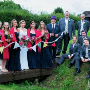 Micklefield Hall Wedding Photography - the bridal party pose for the camera in the gardens