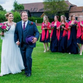 Micklefield Hall Wedding Photography - the newlyweds take a stroll with their bridesmaids in the gardens