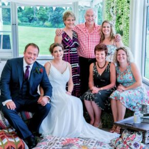 Micklefield Hall Wedding Photography - small relaxed group pose inside the marquee