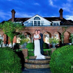 Micklefield Hall Wedding Photography - the bride and groom captured at dusk in the fabulous gardens