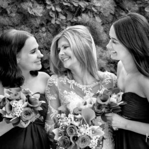 The bride giggling with her fun loving bridesmaids in the wonderful gardens at this gorgeous venue