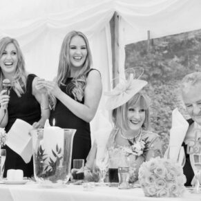The bridesmaids make their lively speech to an appreciative audience in the marquee
