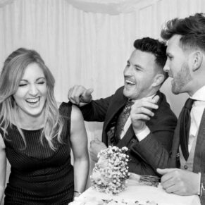 Guests larking around in the marquee during the lively marquee evening reception