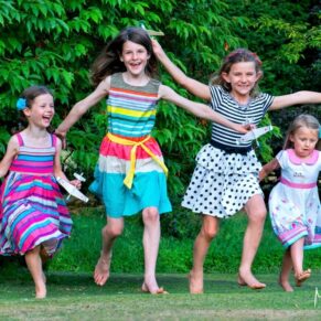 These young girls really thought they could fly as they buzzed around at this fun wedding