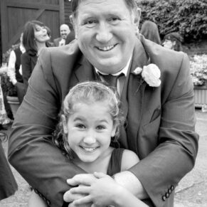 Monkton Barn Wedding Photography - its hug time during the drinks reception