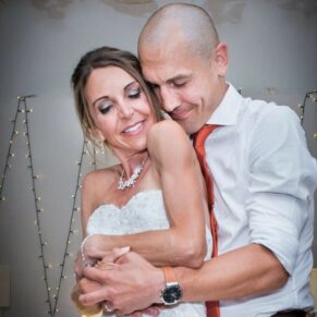 Monkton Barn Wedding Photography - the newlyweds embrace during their first dance