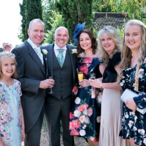 Notley Tythe Barn Wedding Photography - an informal friends group pose taken during the drinks reception