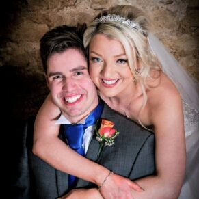 Notley Tythe Barn Wedding Photography - the newlyweds pose for my camera inside the barn
