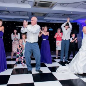 Odney Club Wedding Photography - a choreographed first dance from the bridal party