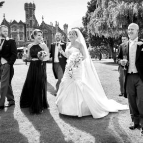 Odney Club Wedding Photography - the bridal party take a stroll in the venue's gardens