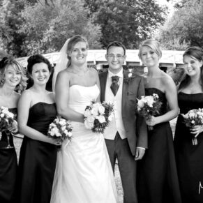 Odney Club Wedding Photography - the newlyweds and their bridesmaids pose for my camera beside the river