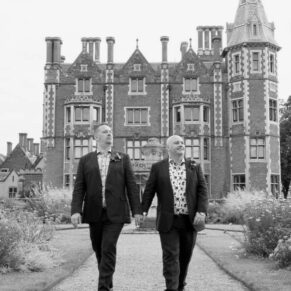 Same Sex Buckinghamshire Wedding Photography - the grooms wander through the grounds of their reception venue
