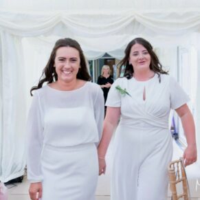 Same Sex Buckinghamshire Wedding Photography - it's all smiles from these lovely brides as they enter their marquee reception