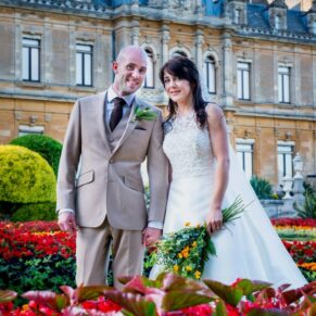 The newlyweds captured up at the manor surrounded by gorgeous red flowers before returning to their reception at The Dairy