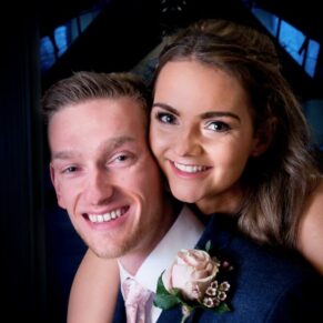 An embrace from the newlyweds with lovely soft lighting captured at The Dairy on the Waddesdon Estate