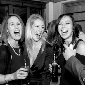 Lots of laughter at the bar during the drinks reception between these fun loving wedding guests