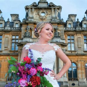Five Arrows Hotel - Buckinghamshire Wedding Photographer - the bride strikes a pose in front of Waddesdon Manor