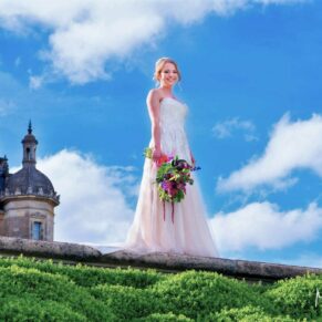 Five Arrows Hotel - Buckinghamshire Wedding Photographer - the bride strikes a dramatic pose up at Waddesdon manor