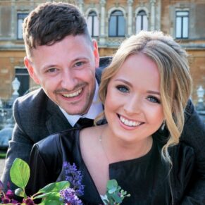 Five Arrows Hotel - Buckinghamshire Wedding Photographer - the bride and groom embrace in front of Waddesdon Manor