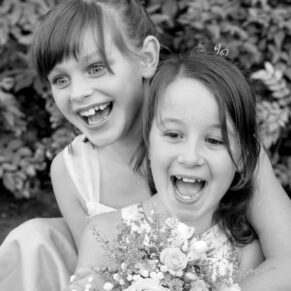 Five Arrows Hotel - Buckinghamshire Wedding Photographer - these two young girls enjoy a giggle in front of the camera