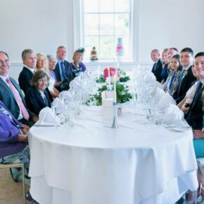 All the guests captured around the dining table at The Grove Hotel in Hertfordshire