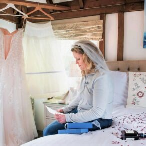Old Luxters Wedding Photography - the bride reads her good luck cards pre ceremony