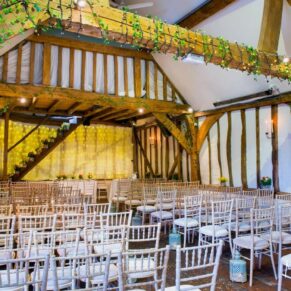 Old Luxters Wedding Photography - stunning interior setup inside the barn for the civil ceremony