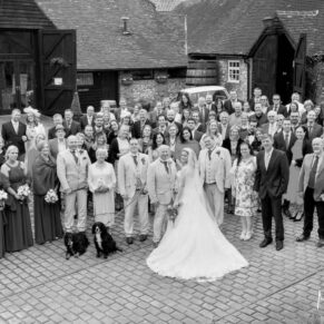 Old Luxters Wedding Photography - everyone captured from high above in the courtyard