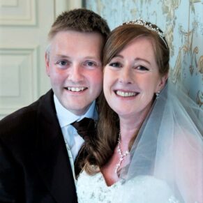 The newlyweds pose for my camera in the Oak Room at their Pendley Manor Hotel wedding
