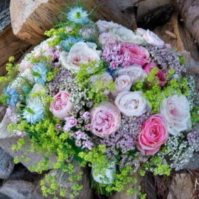 Stunning bouquet captured against a rustic wood backdrop at Pendley Manor Hotel wedding
