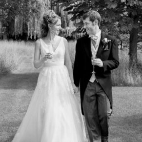 Runnymede Hotel Wedding Photography - the newlyweds take a stroll in the grounds of the venue