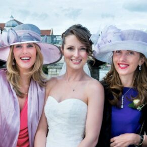 Sir Christopher Wren Hotel Wedding Photography - the bride with a couple of girlfriends poses for the camera