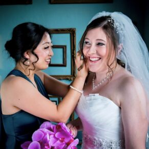 Stoke Place wedding photography - final adjustments for the bride before the ceremony