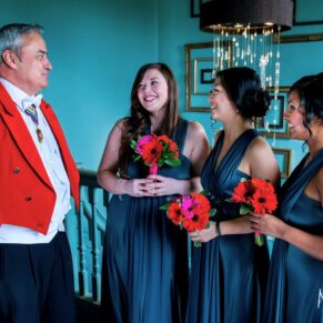 Stoke Place wedding photography - the bridesmaids having a catch up with the toastmaster