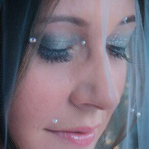 Stoke Place wedding photography - close-up bridal portrait shot through the veil