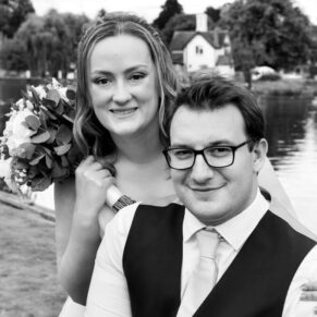 Swan at Streatley wedding photography - the newlyweds pose for a portrait beside the river