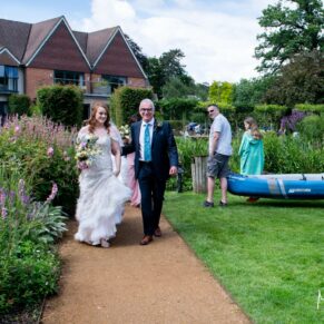 Swan at Streatley wedding - the bride on route to the civil ceremony meets some kayakers on the way