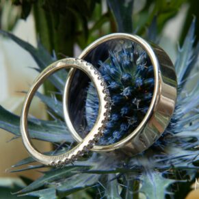 Swan at Streatley wedding - the newlyweds rings placed on a flower in the bouquet