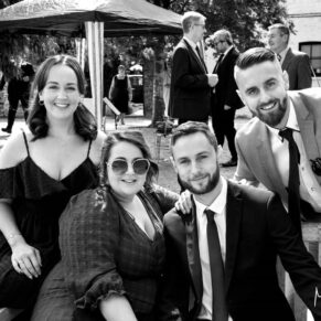 Guests captured on the terrace during the drinks reception at the Tudor Barn in Burnham