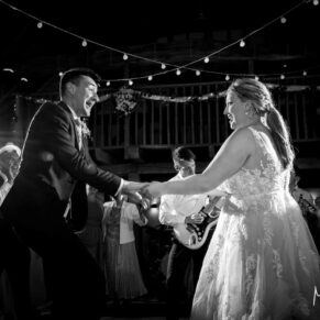 The action packed first dance of the bride and groom at their Tudor Barn evening reception
