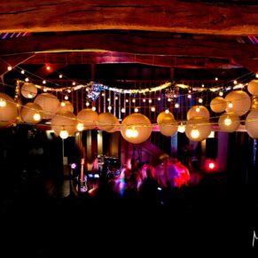 The atmospheric Tudor Barn interior during the evening's dancing