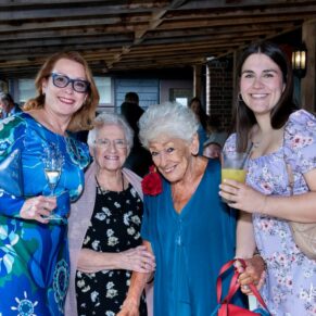 A casual group pose captured during the drinks reception at The Olde Bell in Hurley
