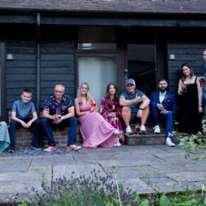 A casual pose of the wedding guests outside their hotel rooms at The Olde Bell in Hurley