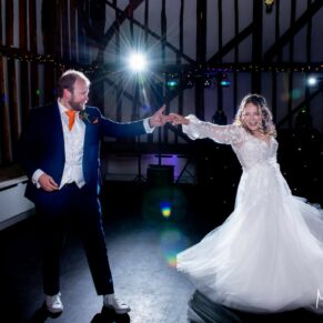 The first dance for the newlyweds at their Olde Bell wedding in the village of Hurley with some dramatic moves and disco lighting